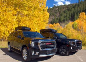 GMC Yukon SUVs in autumn Colorado — restaurant and night out rides