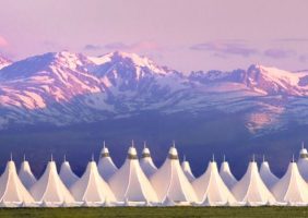Denver International Airport terminal — private car service to Vail